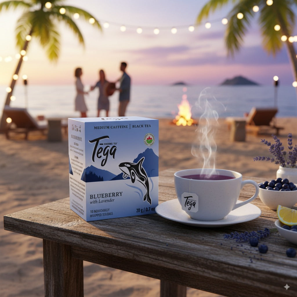 Blueberry Lavender Organic Tea in coastal setting with steaming cup on table at sunset.